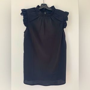Black sheath blouse w/ self ruffle neckline & sleeve.